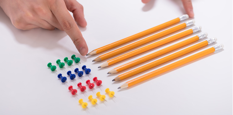 man organizing pens