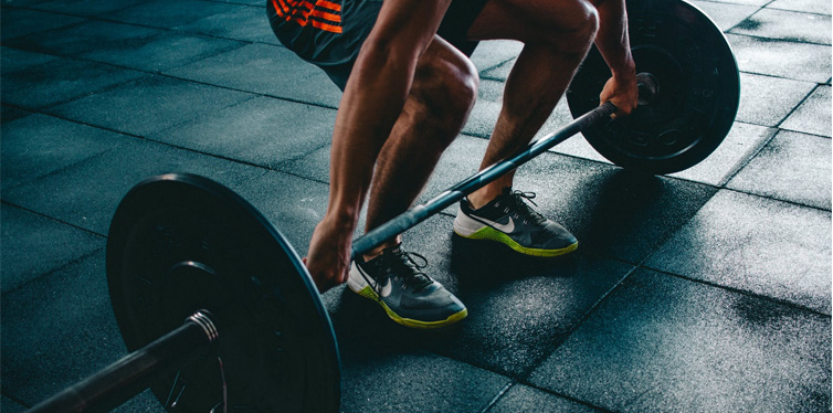 man holding barbell