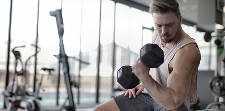 man lifting weights