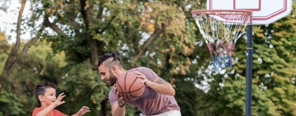 father and son playing basket