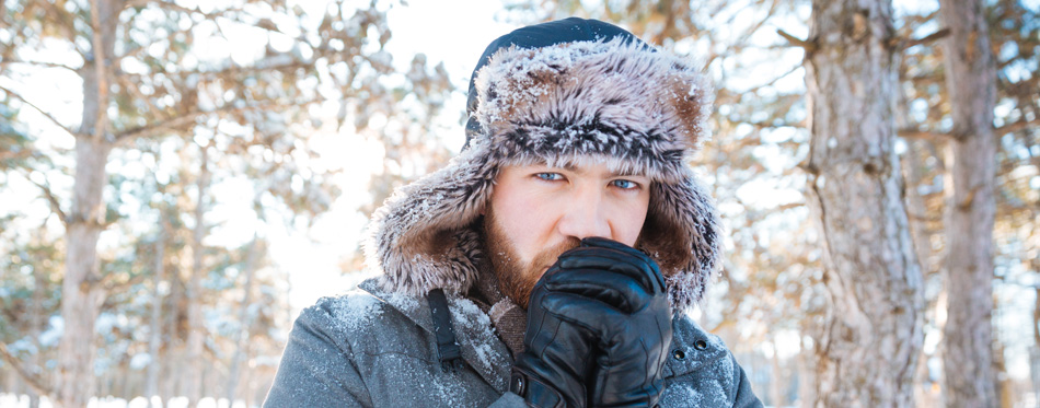 man in the woods wearing best men’s hat for every occasion