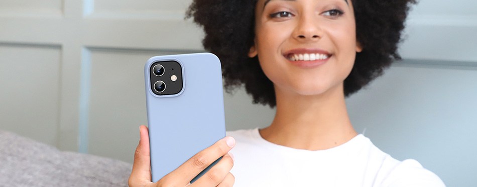 woman smiling holding iphone with iphone 12 case