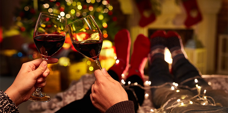 couple drinking red wine on christmas