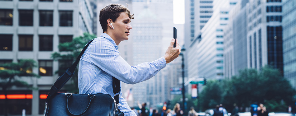 man using earbuds while talking on skype