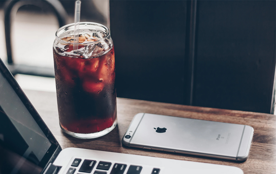 cold brew coffee next to an iphone