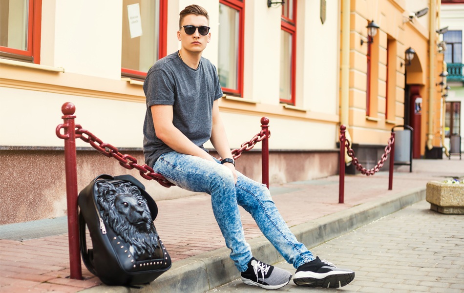 man in stretch jeans in the street