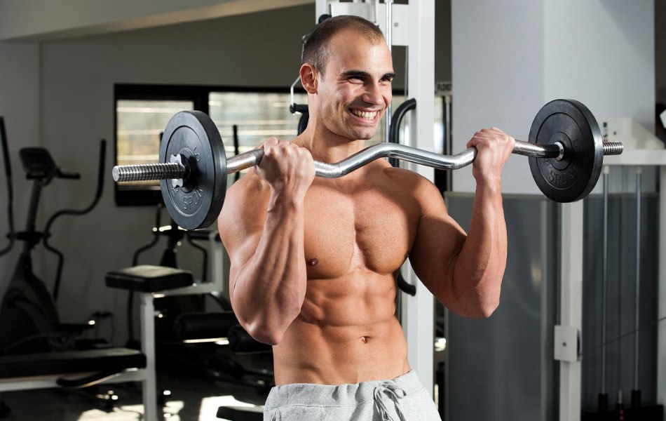 man using a curl bar