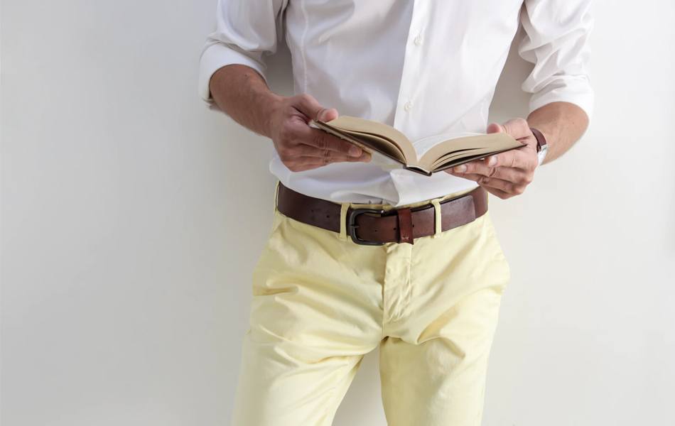 man wearing leather belt