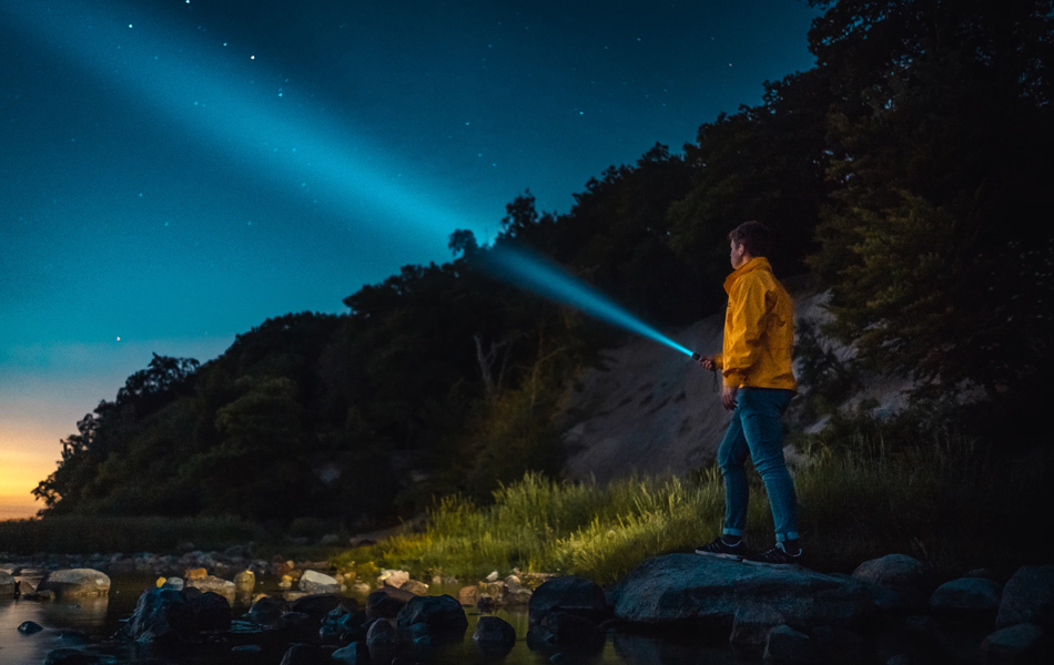 man with a rechargeable flashlight