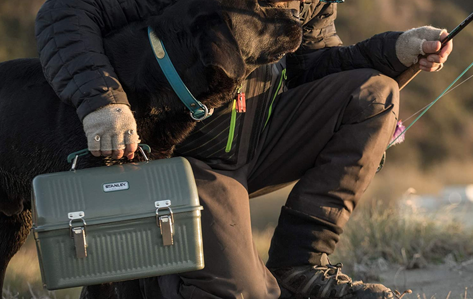 man with the dog carrying a lunch box