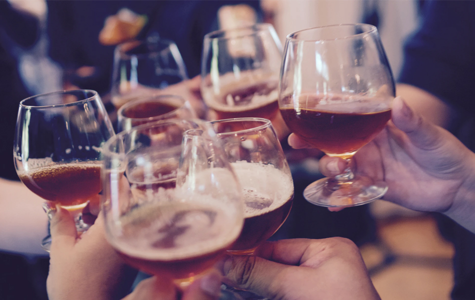 people cheering with beer