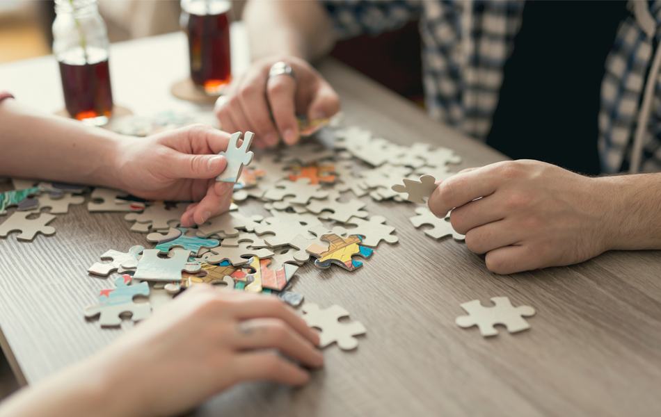 people solving a puzzle