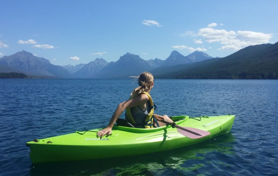 a woman in a kayak boat