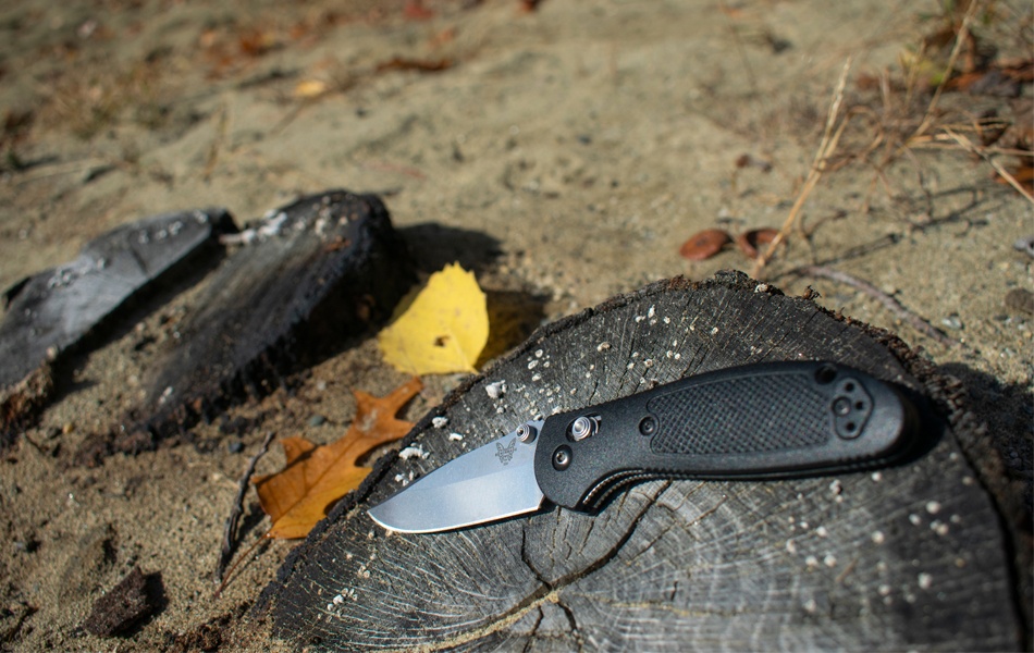 benchmade knife on a tree stump