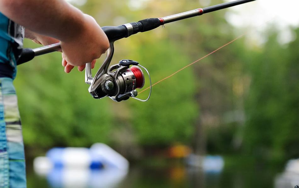 man using fishing reel