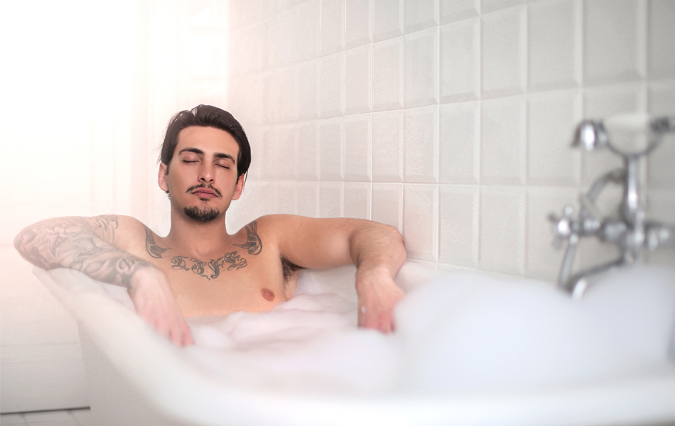 man enjoying in a bath tub