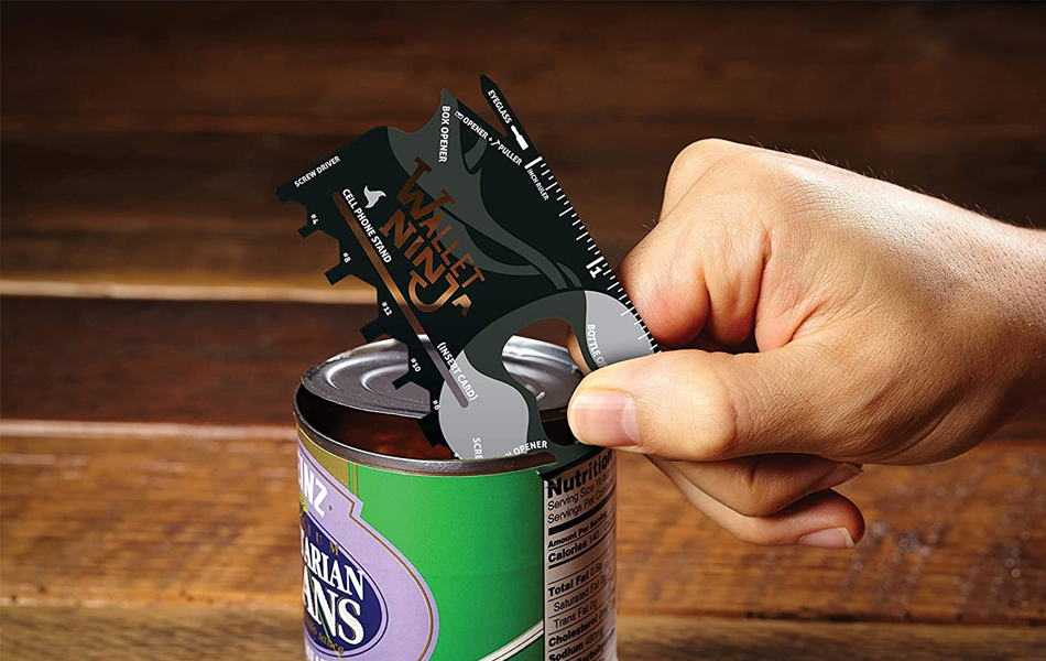 man opening a can with a card tool