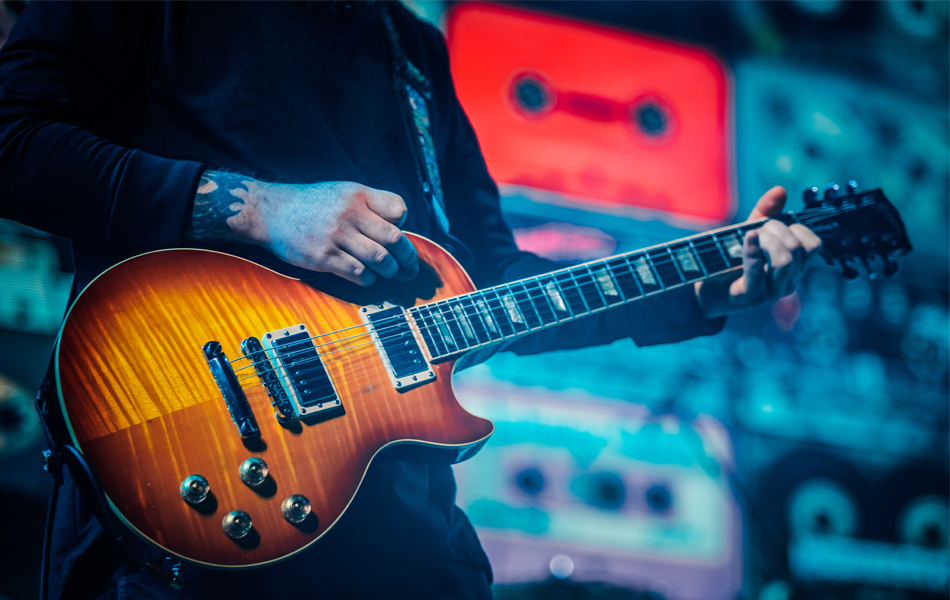 man playing electric guitar