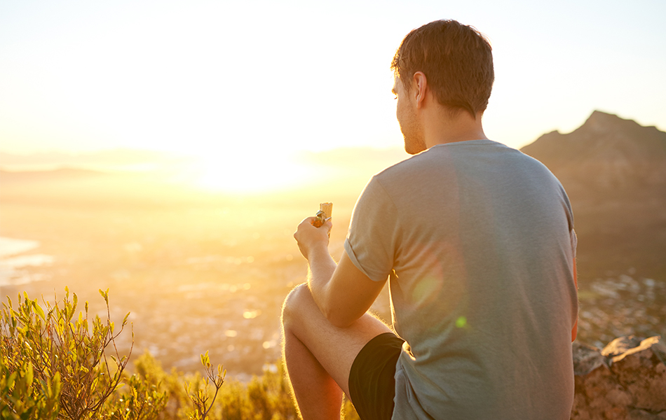 eat a protein bar while watching the sunrise