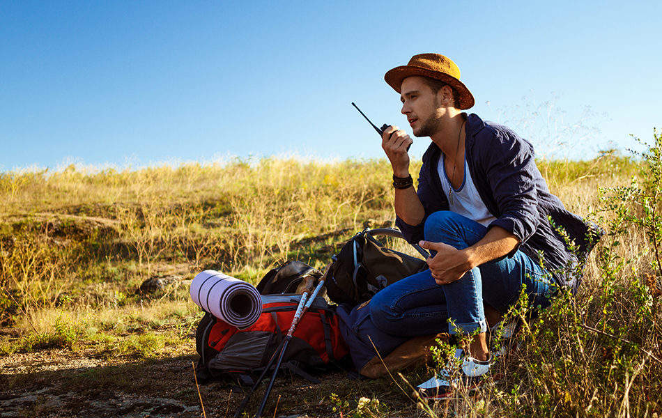 man talking on walkie talkie