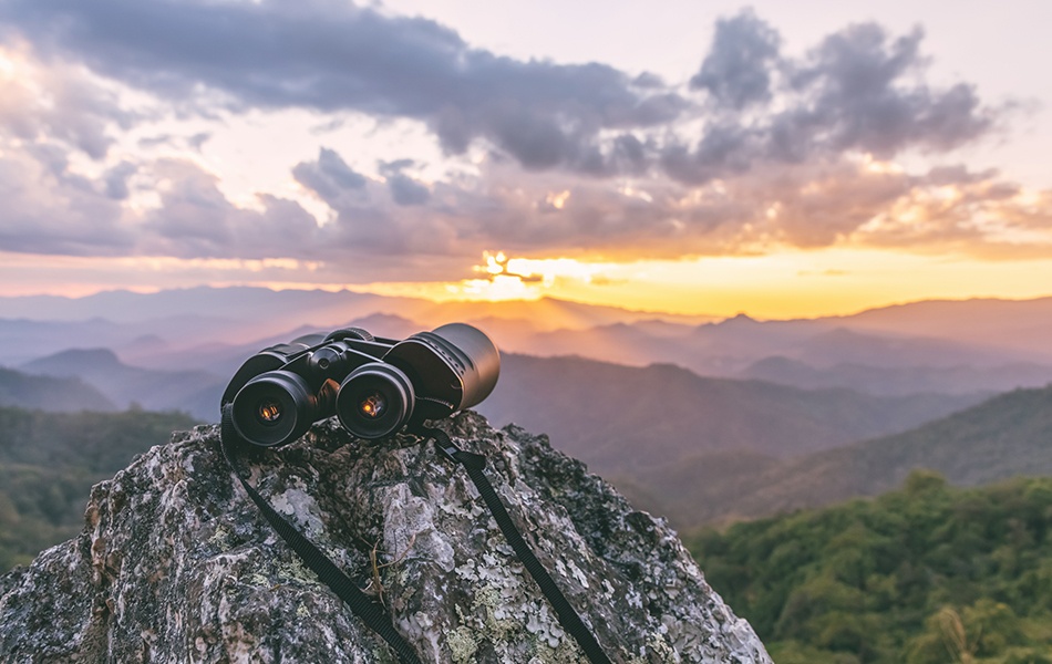 binoculars on top of rock