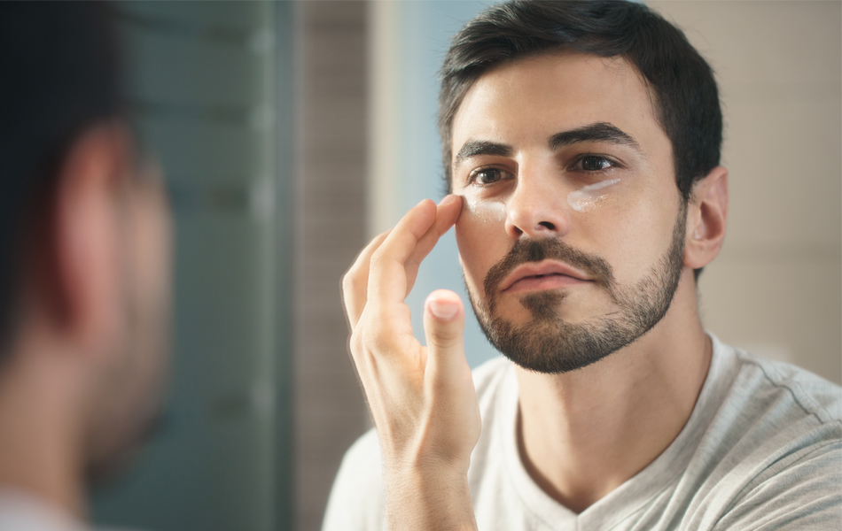 man applying eye cream faq