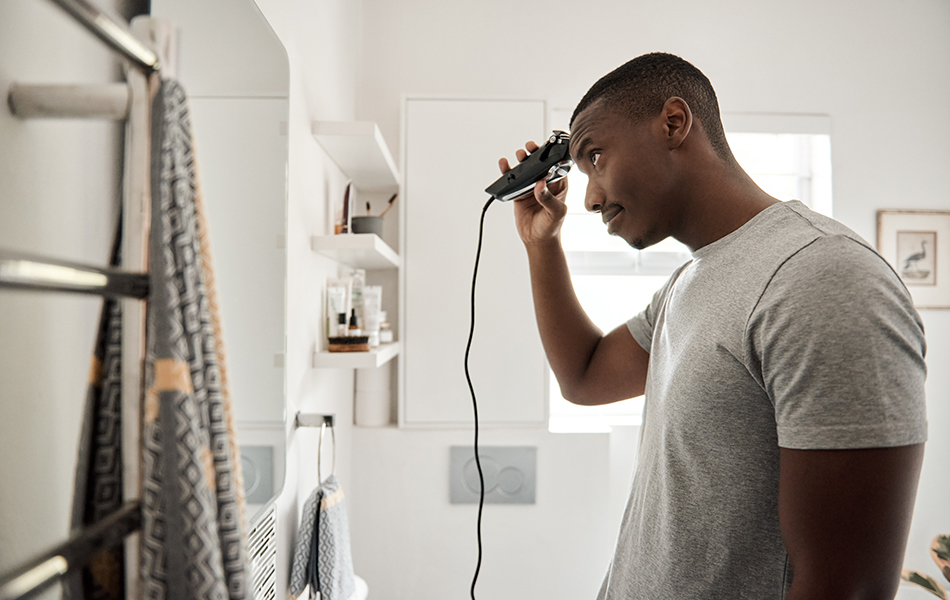 man using hair clipper