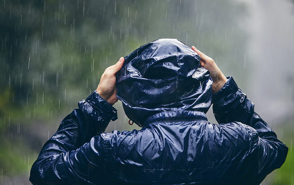 young man in rain jacket