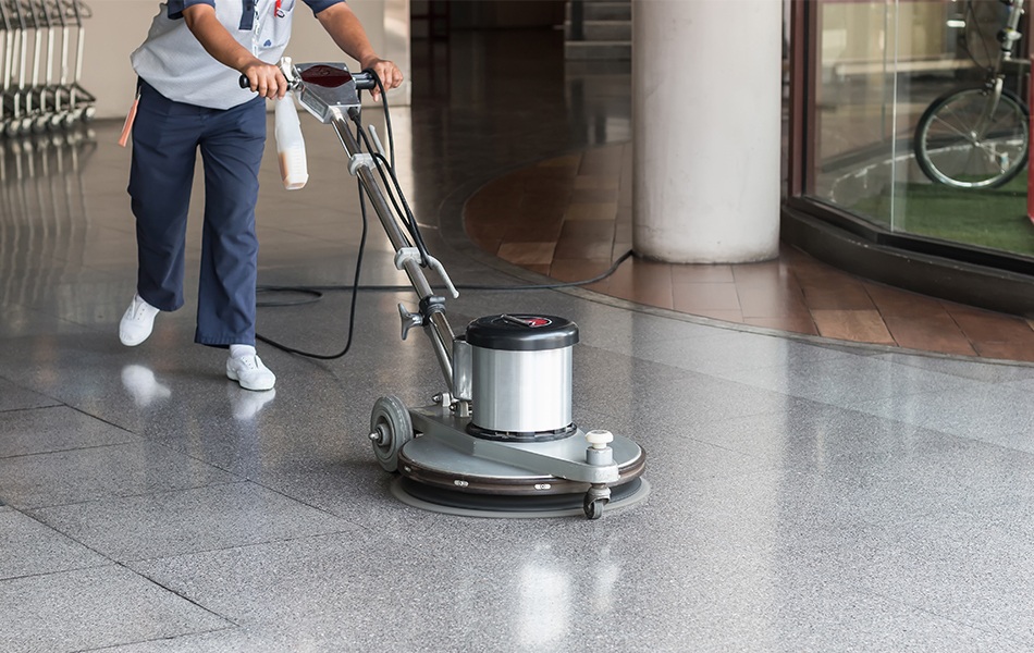 cleaning the floor with floor polisher