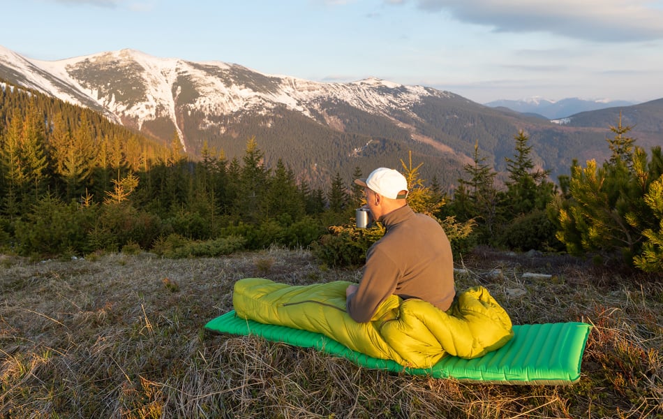 man in sleeping pad for camping & backpacking faq