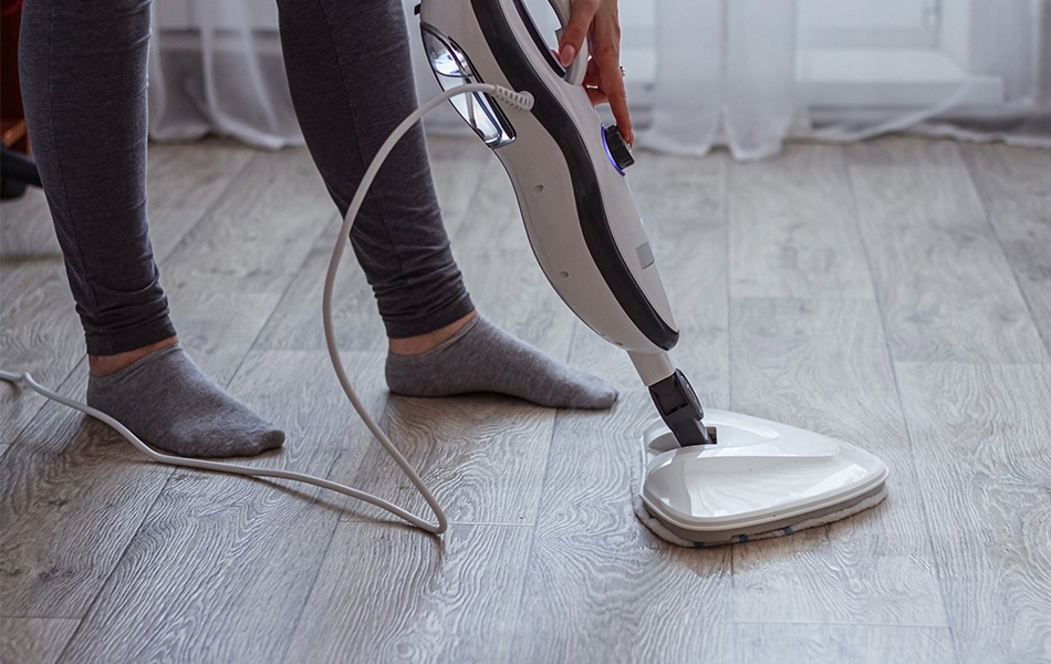 girl using a steam mop