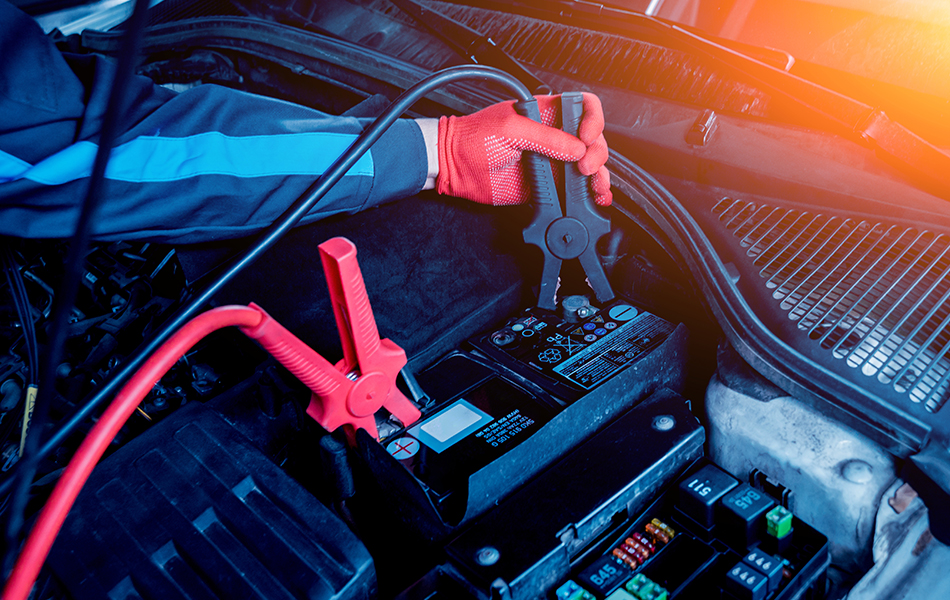 man using car jump starters