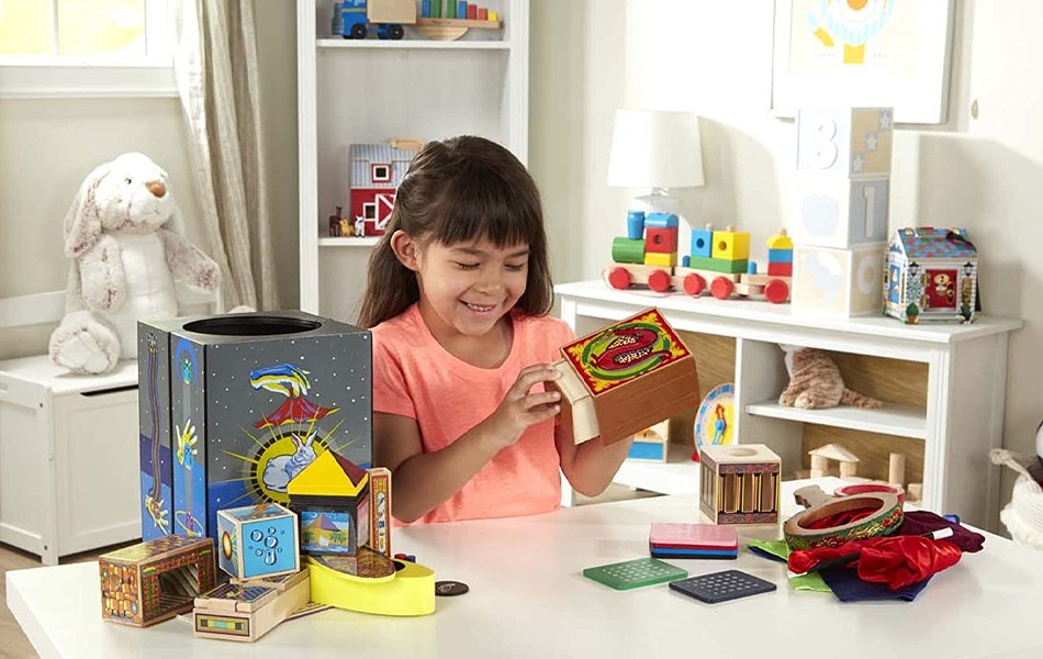 girl playing with magic kit