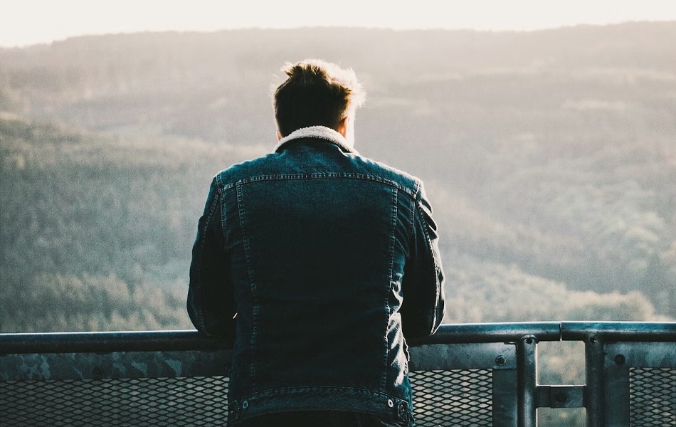 man wearing denim jacket