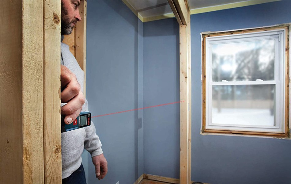 men using-bosch laser distance measure
