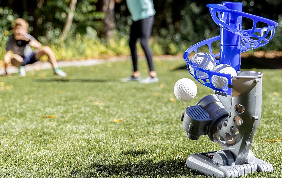 kids playing baseball with pitching machine