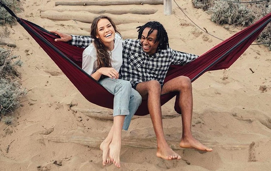 man and woman in a hammock