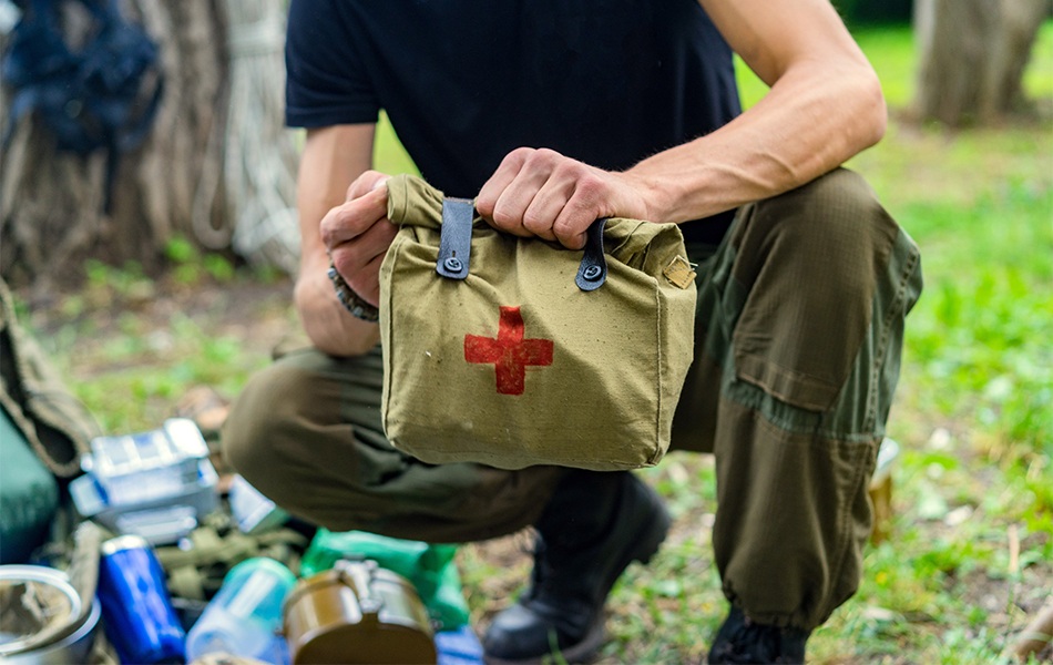 man using emergency survival kit