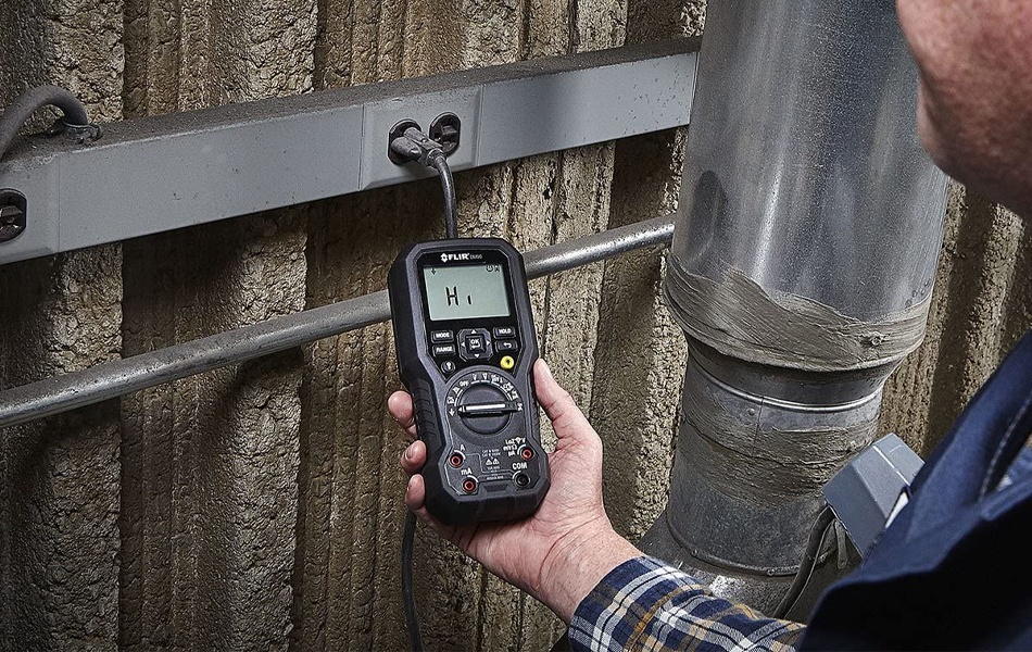 man using multimeter