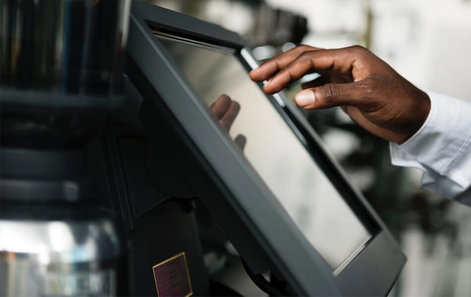 man using touch screen monitor