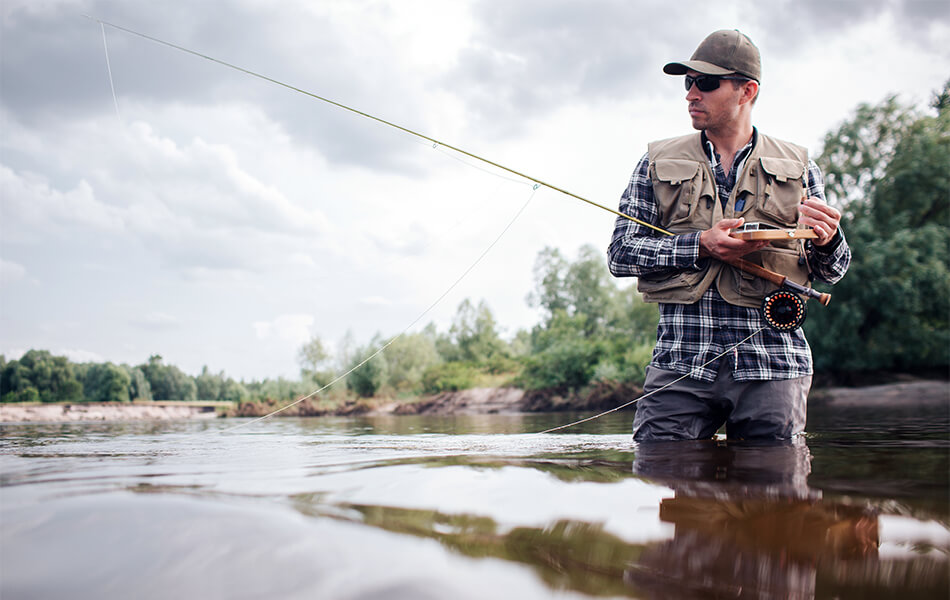 man wearing fishing vest