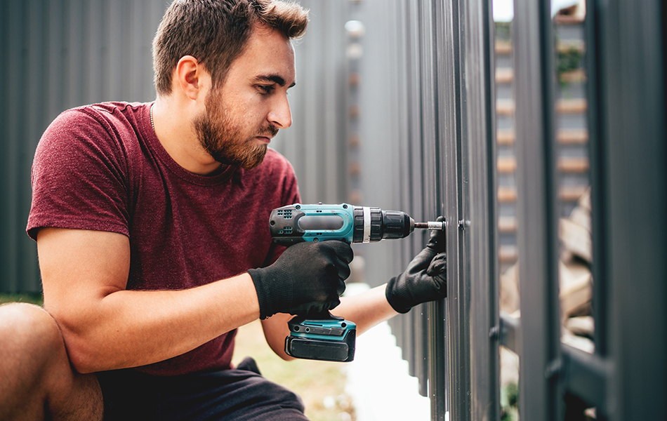 man working with power screwdriver