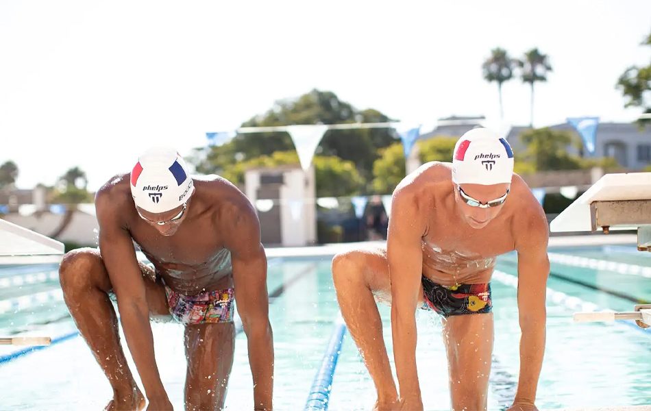 two man wearing swimming goggles