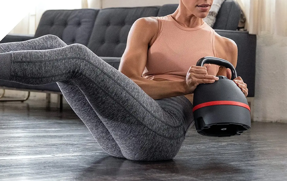 woman exercising with kettlebell