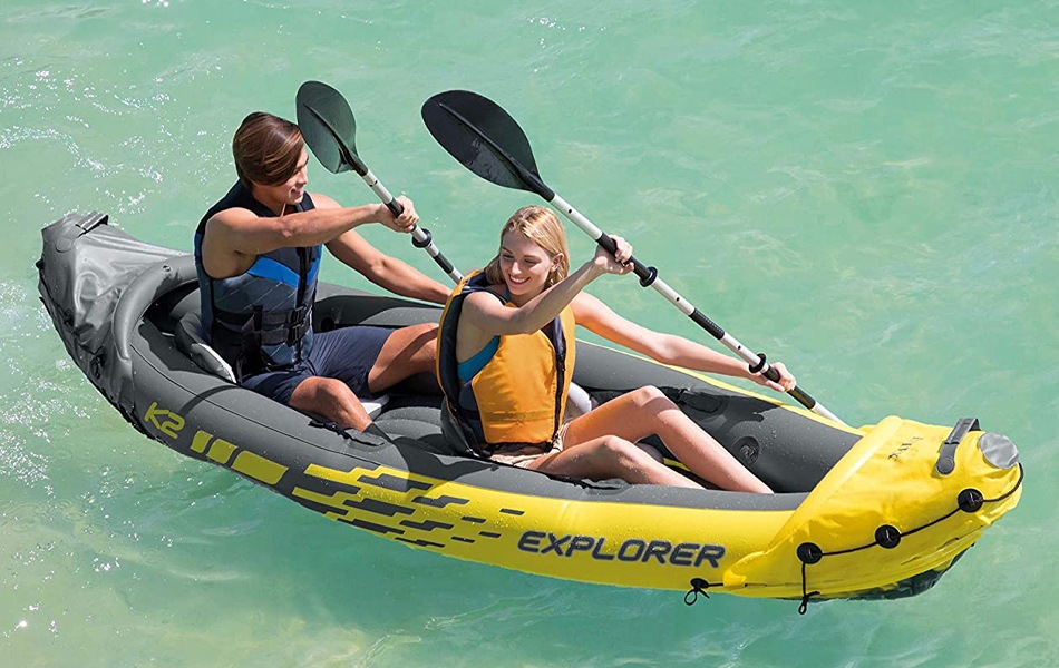 couple paddling on a inflatable boat