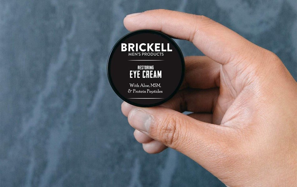 man holding anti-aging cream