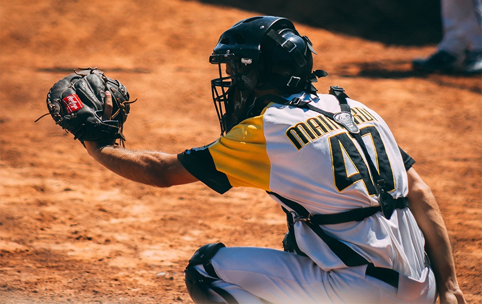 man playing baseball using baseball glove