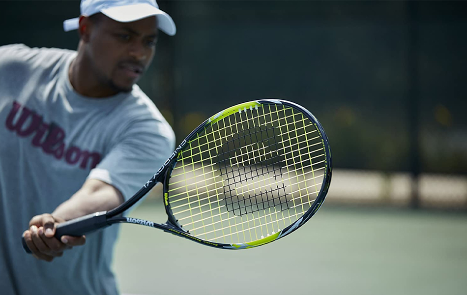 man playing tennis with tennis racquet