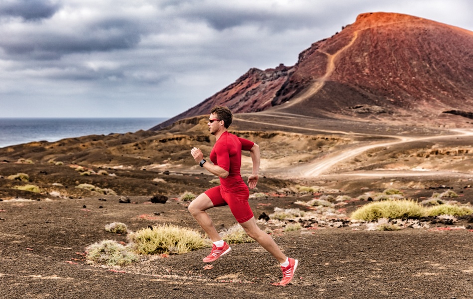 man running in desert wearing compression shorts