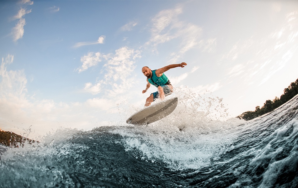 man surfing on wakesurf board